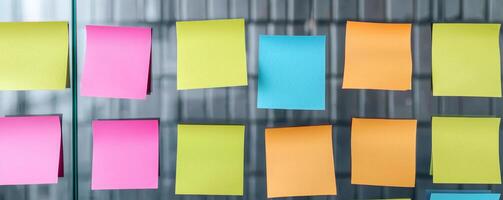 Colorful sticky notes arranged on a metallic surface. photo