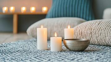 Cozy setup with candles and decorative bowl on a patterned blanket. Wellness and Self-Care Mindfulness and Meditation concept. photo