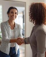handshake between client and realtor in new apartment, photo