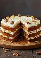 A beautiful, multi layered carrot cake topped with walnuts and cream cheese frosting. photo