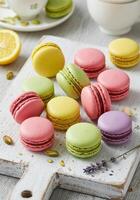 A visually appealing display of colorful macarons with pistachios, lemons, and lavender. photo