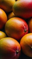 A collection of juicy, ripe mangoes with vibrant colors and rich textures showcased. photo