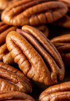 Close up view of several shelled pecans, perfect for adding texture and natural flavour to any recipe. photo