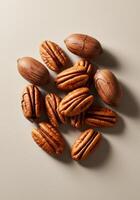 Overhead view of a group of pecans, both shelled and in their natural shells. photo