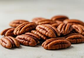 A cluster of delicious, shelled pecans, ready to enjoy in a close up shot. photo