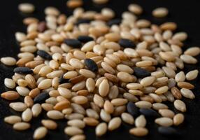 Close up of a pile of mixed sesame seeds, showcasing colors and textures. photo