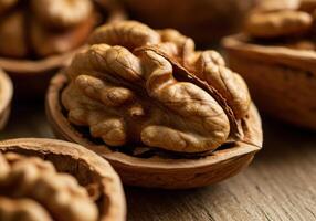 A detailed close-up shot reveals a shelled walnut alongside its textured, brown shell on a wooden surface. photo