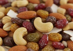 Delicious and colorful mix of nuts, dried fruits, and seeds for a healthy snack. photo