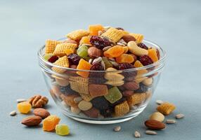 A vibrant bowl of trail mix featuring a delightful mix of nuts and dried fruits, ready to enjoy. photo