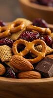 A delightful close-up of a mix of pretzels, almonds, and dried cranberries. photo