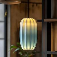 Elegant hanging light fixture emitting soft illumination in a modern interior, showcasing its fluted design and gradient color scheme creating a warm and inviting ambiance for home decor photo