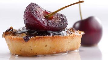 Closeup of a Juicy Red Cherry on a Sweet Tart Dessert photo