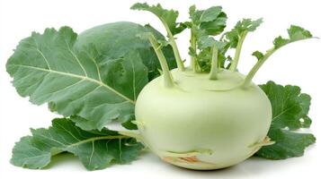 Crisp Green Kohlrabi with Fresh Leaves on White Background photo