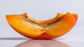 Juicy Orange Apricot Slice Isolated on White Background photo