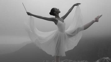 Graceful Ballerina in White Tutu on Misty Mountaintop photo