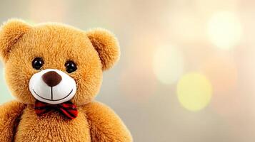Closeup of a Light Brown Teddy Bear with Bow Tie Against Warm Bokeh Background photo