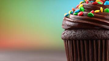 Closeup of Chocolate Cupcake with Sprinkles and Swirled Frosting photo