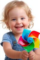Joyful Toddler Girl with Pinwheel photo
