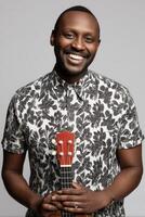 Smiling Black Man with Ukulele in Studio Portrait photo