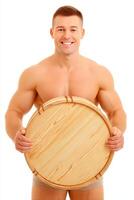 Smiling Muscular Man Holding Large Round Wooden Tray photo