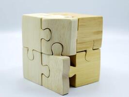 Wooden Puzzle Cube on White Background photo