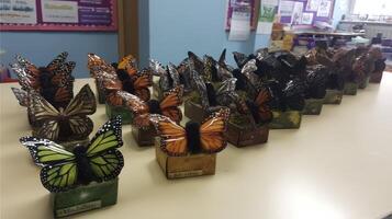 Colorful Artificial Butterflies Arranged on Table photo