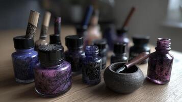 Assorted Ink Bottles and Calligraphy Tools on Wooden Desk photo