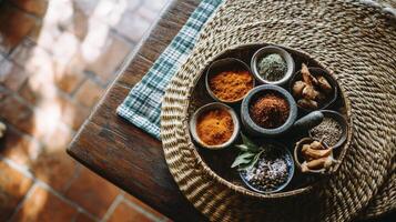 Colorful Spices and Herbs on Rustic Wooden Table photo