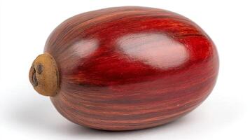 Close Up of a Single Bright Red Pomegranate Seed Isolated on White Background photo