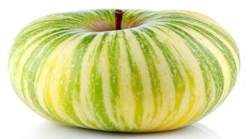 Striped Green and Yellow Apple on White Background photo