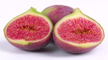 Two Halved Purple Figs on White Background Studio Shot photo