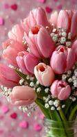 Pink tulip bouquet with delicate gypsophila against a pastel pink background in a cheerful setting photo