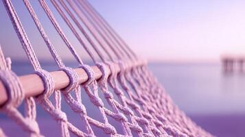 Serene Pink Hammock on a Beach at Sunrise photo
