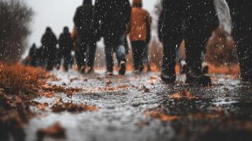 Rainy Street Scene Pedestrians Walking Through Wet Leaves photo