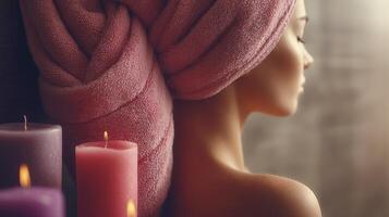 a woman with a towel wrapped around her head and three candles photo
