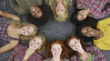 Diverse Group of Smiling Young Women in a Circle on Gray Background photo