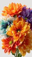 Colorful arrangement of vibrant flowers featuring orange, purple, and blue blooms against a light background photo