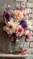 Colorful floral arrangement in a vintage glass vase set against a textured brick wall photo
