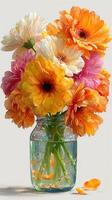 Beautiful bouquet of colorful flowers in a glass jar on a light background, showcasing nature's vibrant beauty photo