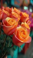 Beautiful orange roses on display at a vibrant flower market during the daytime photo