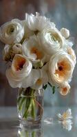 Elegant white flowers in glass vase with soft petals and warm highlights on a subtle background photo