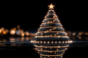 Creative tire Christmas tree illuminated by lights reflected in dark water setting photo