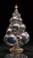 Colorful disco ball Christmas tree decorated for the holidays in a festive setting with twinkling lights photo