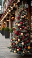 Christmas tree adorned with red and gold decorations beside a winter street in a bustling urban setting photo