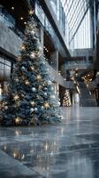 Elegant Christmas tree adorned with decorations in a modern building lobby during holiday season photo