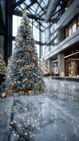 Elegant holiday decor in a modern building featuring a beautifully lit Christmas tree and glowing ornaments photo