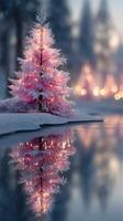 Beautiful pink Christmas tree reflects on serene water during a snowy winter evening in a peaceful setting photo