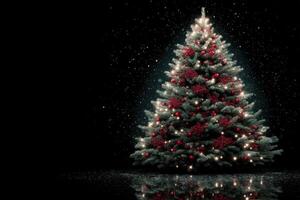 Decorative Christmas tree with red ornaments and lights in a snowy backdrop creating a festive atmosphere for the holidays photo