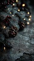 Decorative pine branches with warm lights and pine cones create a cozy winter ambiance photo