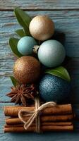 Decorative arrangement of festive ornaments and spices on rustic wooden background photo